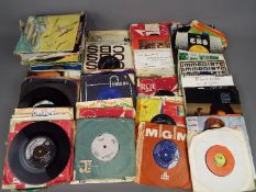 Approximately 130 7" vinyl records to include Bob Dylan, John Lennon, Motown, The Beatles,