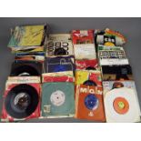 Approximately 130 7" vinyl records to include Bob Dylan, John Lennon, Motown, The Beatles,