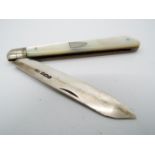 A George V silver and mother of pearl folding fruit knife, vacant cartouche to the handle,