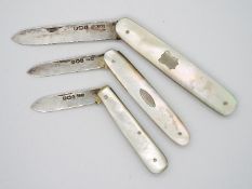 Three George V silver and mother of pearl folding fruit knives, all Sheffield assay,