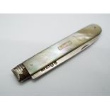 A George III silver and mother of pearl folding fruit knife, Sheffield assay 1819,