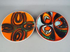 Poole - Two Poole Pottery 'Delphis' range shallow dishes, shape 4, approximately 27 cm (d).
