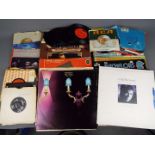 A collection of 7" and 12" vinyl records to include Tamla Mowtown, Procol Harum, The Who,