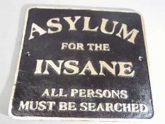 A cast sign marked 'Asylum'