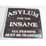 A cast sign marked 'Asylum'