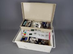 A sewing box with contents.