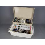 A sewing box with contents.