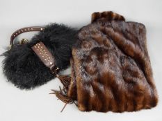 A fur stole and a handbag marked 'Coccin