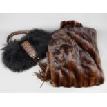 A fur stole and a handbag marked 'Coccin