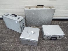 Four aluminium flight cases of varying s