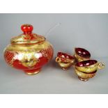 A Venetian, ruby glass punch bowl and cover with six glasses,