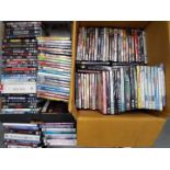 A large quantity of DVD's to include feature films, comedy series, military related,