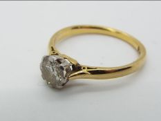 An 18ct gold and platinum diamond solitaire ring, approx 0.