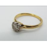 An 18ct gold and platinum diamond solitaire ring, approx 0.