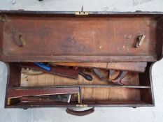 A vintage tool chest with contents.