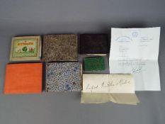 A collection of vintage autograph books containing autographs, signed press clippings,