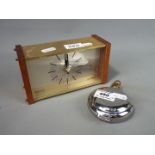 A Dalvey St Elmo travel alarm clock and a Westclox mantel clock.