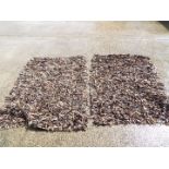 Two unusual leather 'shag' rugs approximately 125 cm x 190 cm.