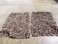 Two unusual leather 'shag' rugs approximately 125 cm x 190 cm.