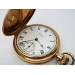 A Waltham Traveler, gold plated, full hunter, crown wind pocket watch.