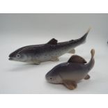 Two Royal Copenhagen fish figurines comprising # 2414 Crucian Carp and # 2676 Rainbow Trout,