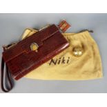 A vintage Italian crocodile skin handbag by Niki of Milan with dust cover and a Pygmalion yellow