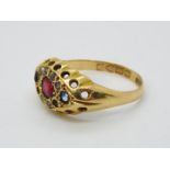 A hallmarked 18ct yellow gold, stone set dress ring, size N, approximately 3.9 grams all in.