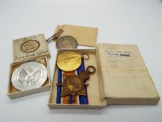 A World War One medal group comprising 1914-1915 Star, Victory Medal and British War Medal,