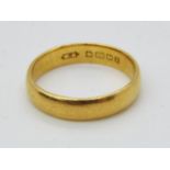 A hallmarked 22ct yellow gold wedding band, size O, approximately 4.6 grams all in.