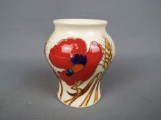 Moorcroft - a Moorcroft vase decorated in the Poppy pattern,