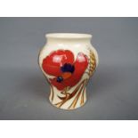 Moorcroft - a Moorcroft vase decorated in the Poppy pattern,