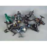 A collection of fishing reels, Shakespeare and similar.