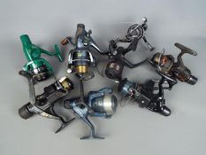 A collection of fishing reels, Shakespeare and similar.