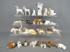 A collection of animal figurines to include Beswick, Royal Doulton, Sitzendorf and similar.