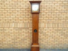 An 18th century hook and spike style 30-hour clock, turned pillar,