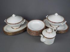 A quantity of dinner ware by Monno in the Oriental pattern # 93096 comprising plates, soup bowls,