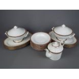 A quantity of dinner ware by Monno in the Oriental pattern # 93096 comprising plates, soup bowls,