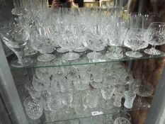 A quantity of good quality glassware to include Stuart Crystal, Brierley and similar, two shelves.