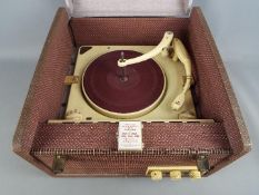 An Ekco mono portable record player with Collaro Conquest turntable and additional stylus.