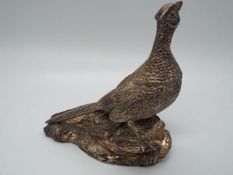 A hallmarked silver figurine depicting a pair of pheasants, Sheffield assay, approximately 11.