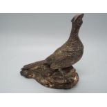 A hallmarked silver figurine depicting a pair of pheasants, Sheffield assay, approximately 11.