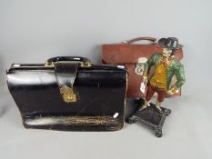 A cast figurine depicting and early New Englander and two vintage satchels / bags.