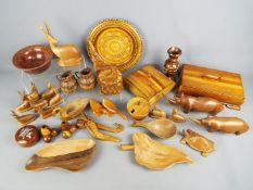 A quantity of various treen including bowls, boxes, animal carvings and similar.