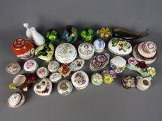 A collection of small ceramic items to include trinket boxes, vases, dishes and similar, comprising,