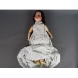 Armand Marseille German bisque porcelain doll. Makers mark: SFBJ 60 Paris. Eyelids closed.