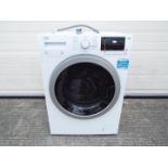 A Beko washer-dryer, model number WDX850130W.