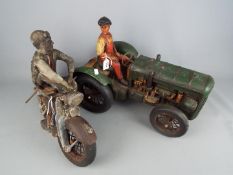 Two vintage decorative models comprising a motorcycle and a tractor,