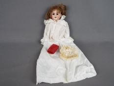 Armand Marseille German bisque doll. Makers mark:1894 AMDEP made in Germany 2/0.