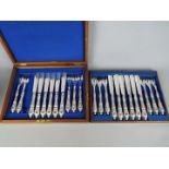 A canteen of plated cutlery, blue and white twin handled bowl and a cut glass footed bowl.