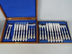 A canteen of plated cutlery, blue and white twin handled bowl and a cut glass footed bowl.